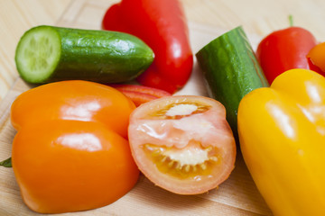 Healthy and Organic Food Concepts. Partial View of Fresh Vegetables Placed on Wooden Surface.
