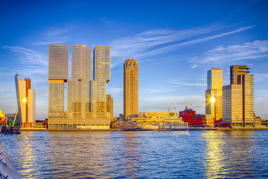 Travel Destinations. Sunny View of Rotterdam Port Cityscape Before the Sunset