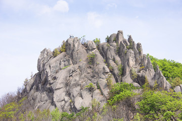 Weekend routes/ Climbers on top of the mountain "dragon" in the Lazovsky region of the Primorsky territory of Russia.