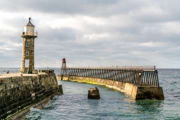 Fototapeta na wymiar Whitby pier and lighthouse 