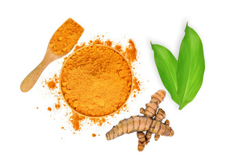 turmeric root and turmeric powder in wooden bowl and spoon with green leaves isolated on white...