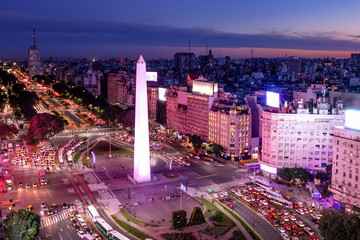 Aerial view of Buenos Aires and 9 de julio avenue at night with purple light - Buenos Aires,...
