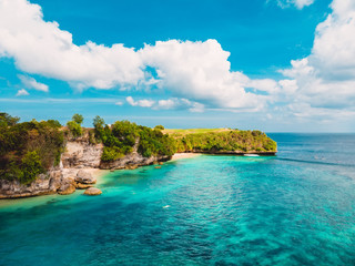 Aerial view of tropical beach with crystal turquoise ocean in Bali