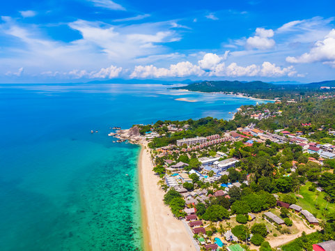 Aerial view of beautiful tropical beach and sea with palm and other tree in koh samui island