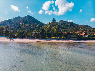 Aerial view of beautiful tropical beach and sea with trees on island