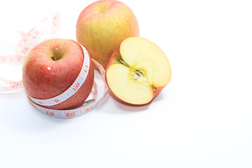Tape measure and apple