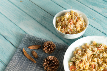Egg Fried rice with a blue wood grain background