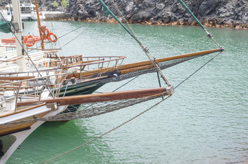 Fototapeta na wymiar Bows on wooden ship in the sea, Santorini