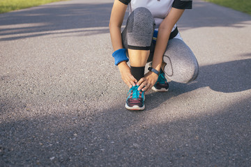 Runner woman suffering from pain in leg injury after sport exercise running jogging and workout outdoor