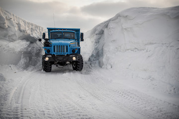 Clearing snow in the Arctic, dump trucks take it out..