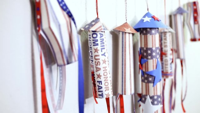 Paper firecrackers made from red, white and blue paper for July 4th celebration