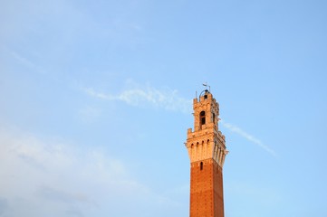 Sunset view of Torre del Mangia Tower of City Hall in Siena, Tuscany, Italy