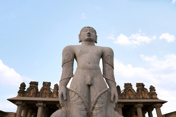 Fototapeta na wymiar A gigiantic monolithic statue of Bahubali, also known as Gomateshwara, Vindhyagiri Hill, Shravanbelgola, Karnataka. View from the temple courtyard.