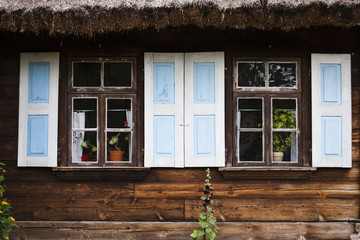 Windows with wooden house shutters in Poland in Podlasie
