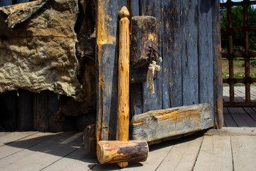 .wooden hammer near the gate