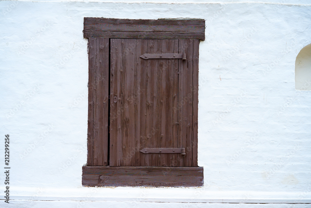 Wall mural old retro window with panes closed on white background