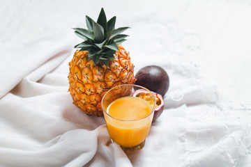 Pineapple and passion fruit juice In the White table background