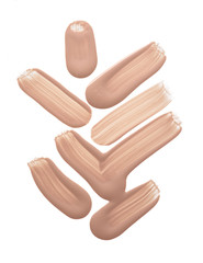 Light beige makeup smear of creamy foundation