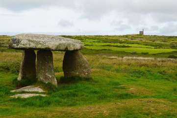 Lanyon Quoit with Ding Dong Tin Mine in the Distance under an overcast sky in May 2017