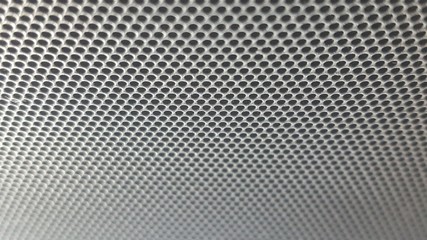 metallic mesh part of microphone and loudspeaker .dot abstract and background.