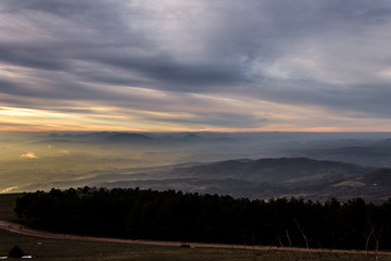 Naklejka na ściany i meble Subasio Mt. (Umbria, Italy), with sky covered by clouds and warm sunset colors