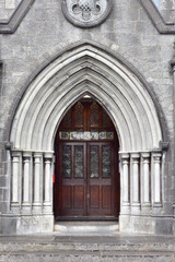 Fototapeta na wymiar Stone portal in early English style of Roman Catholic church of St Michael in Tipperary.