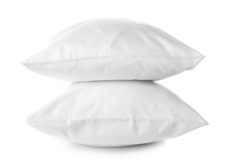 Soft orthopedic pillows on white background