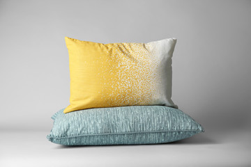Soft decorative pillows on light background