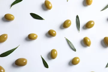 Poster Flat lay composition with fresh olives covered with oil on white background © New Africa