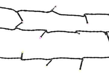 Christmas lights on white background, top view