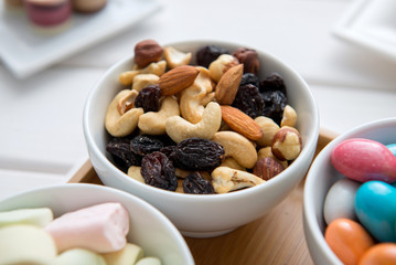 Nuts snacks. In white ceramic plate