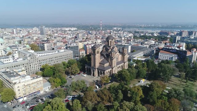 Panoramic drone flight of beautiful St Mark's Church and skyline of Belgrade, Serbia