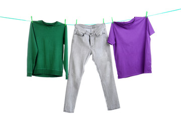 Clothes on laundry line against white background