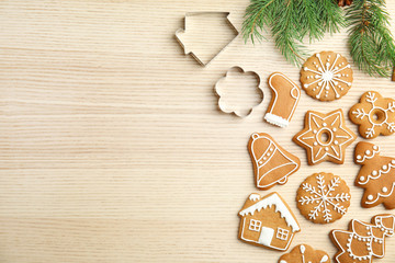 Tasty homemade Christmas cookies on wooden background, top view