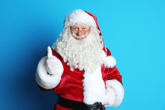 Portrait of authentic Santa Claus on color background
