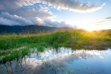 Lake and reflection at the water surface. Natural landscape at the morning time