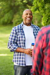 Friends talking and camping.