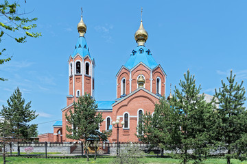 Fototapeta na wymiar Cathedral of Our Lady of Kazan against clear blue sky, Komsomolsk-on-Amur, Russia