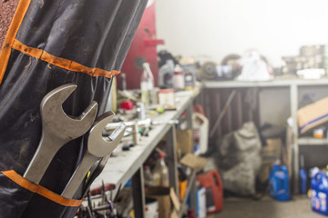 Fototapeta premium Wrenches in a case on a blurry background of the workplace of an auto mechanic