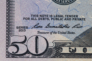 Extreme closeup of fragment of fifty US dollars bill