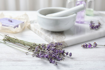 Fototapeta na wymiar Composition with lavender flowers and natural cosmetic products on table