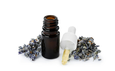 Bottle of essential oil and flowers on white background