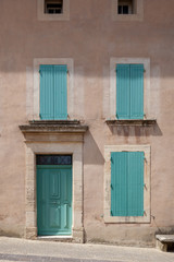 Fototapeta na wymiar Turquoise doors and windows in Venasque, Provence, France