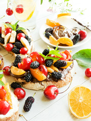 Toasts with chocolate and fruits