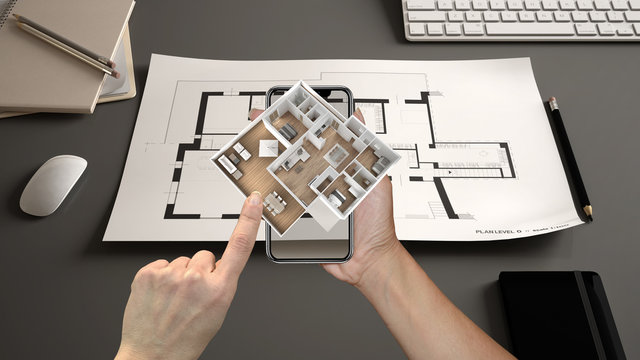 Augmented Reality Concept. Hand Holding Smartphone With AR Application Used To Simulate 3d Pop-up Interactive House Maps To Life