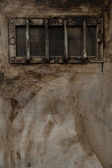 old steel door with small barred window