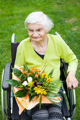 Woman in wheelchair celebrating