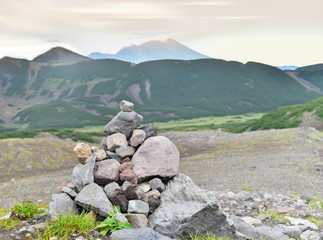 Evening on the territory of the nature Park Nalychevsky. A pyramid of stones made by tourists as a...