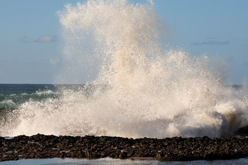 Fototapeta na wymiar waves crashing on rocks at atlantic ocean
