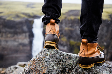 A young man in boots